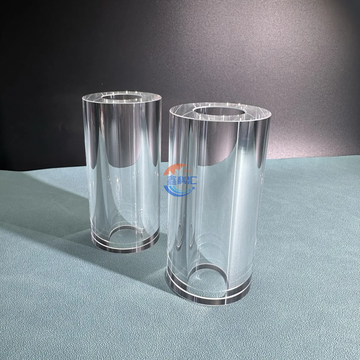 Large bore transparent sapphire cylinders standing upright