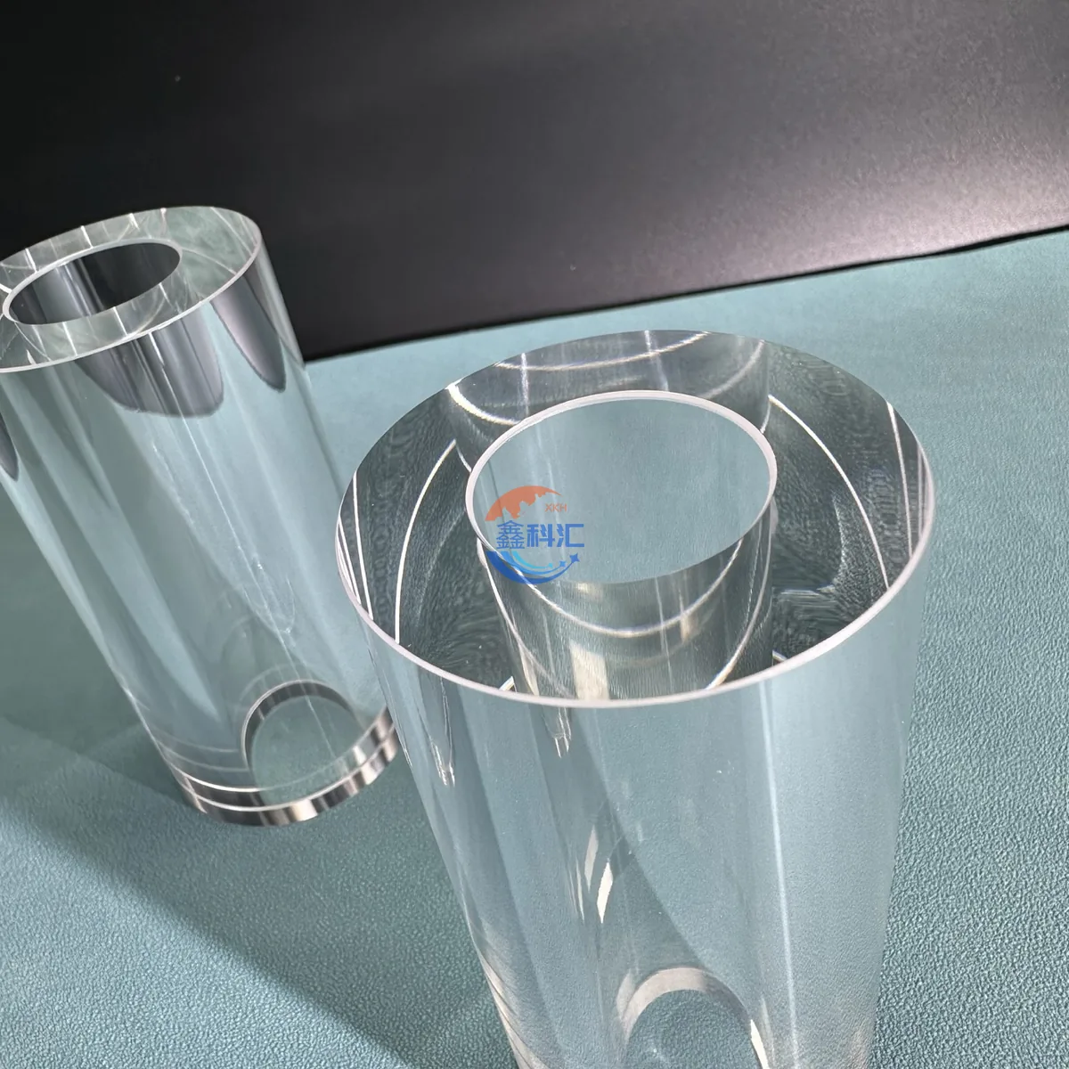 Top view of clear sapphire cylinders showing open bores and wall thickness